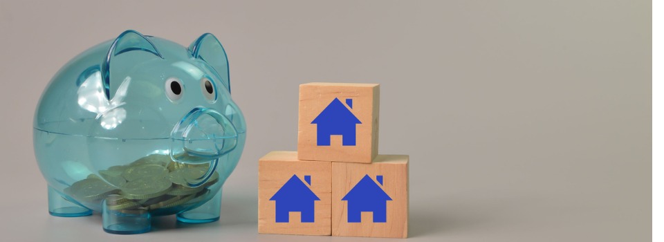 piggy-bank-and-wooden-block-with-home-symbols-picture-id1396702142 (1)